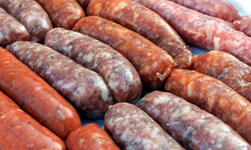 assorted raw sausages