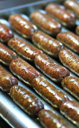 sausages on a roller-cooker